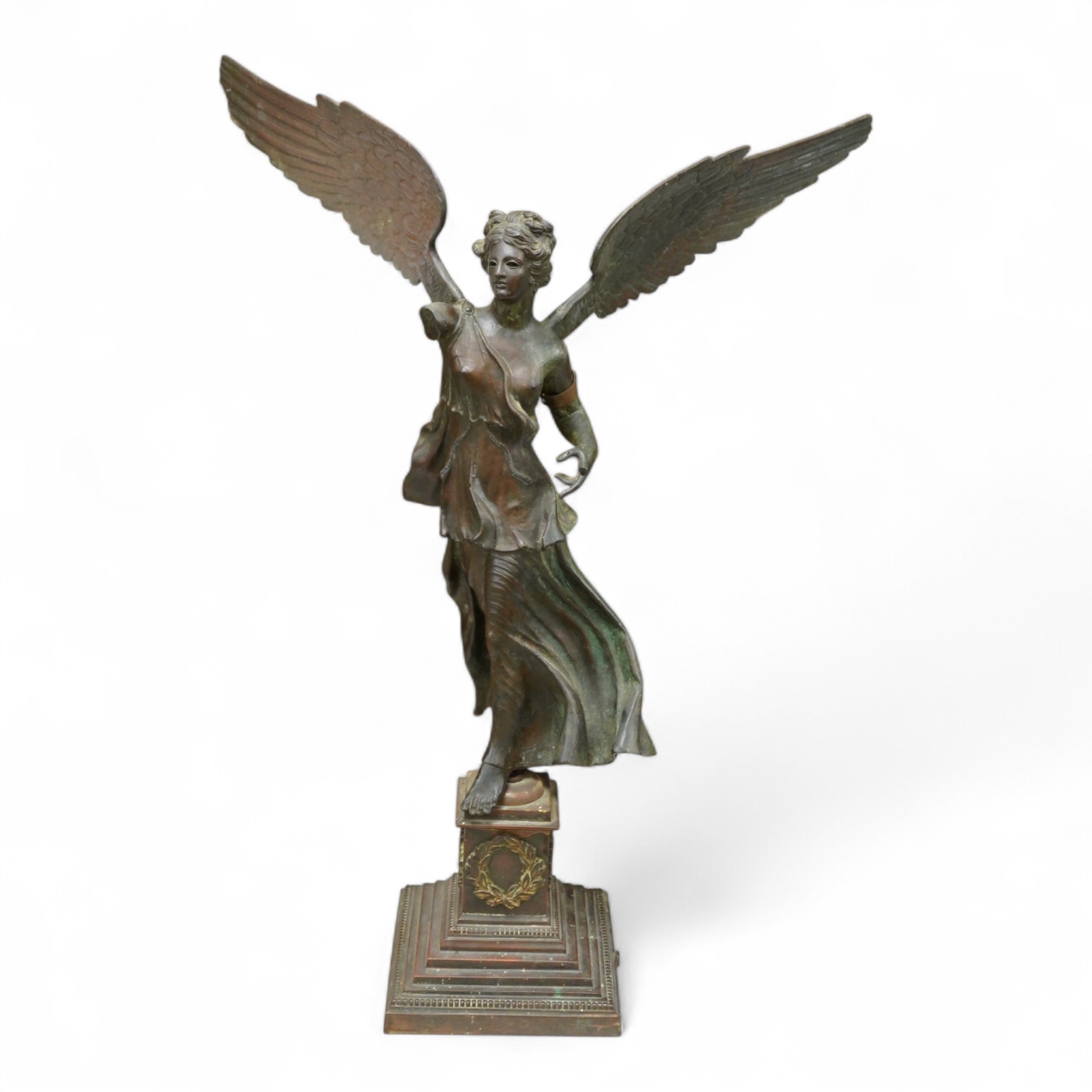 After the antique, an early 20th century bronze figure Winged Victory, on associated base, 60cm high